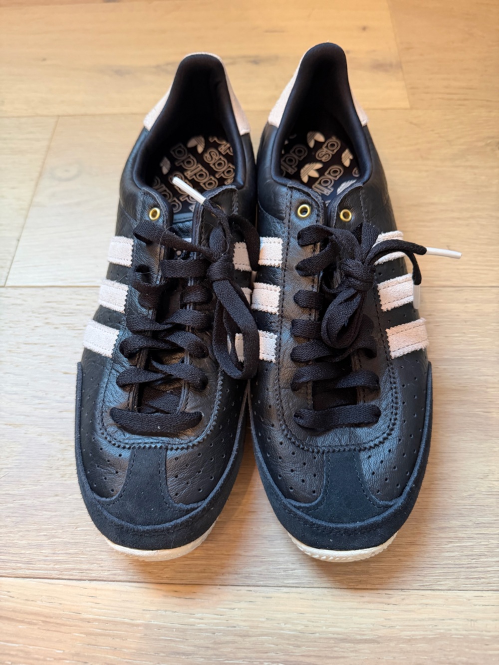 adidas Men’s Black Sneakers with White Stripes